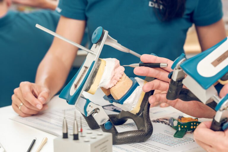 Crop of female orthodontist working with articulator and jaw cas