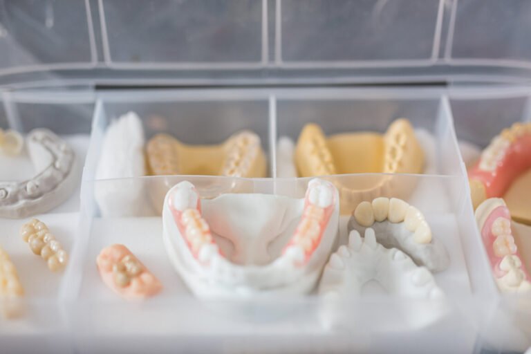 Capitol Dental Laboratory - Closeup of various dental prostheses of different characteristics - dental health concept